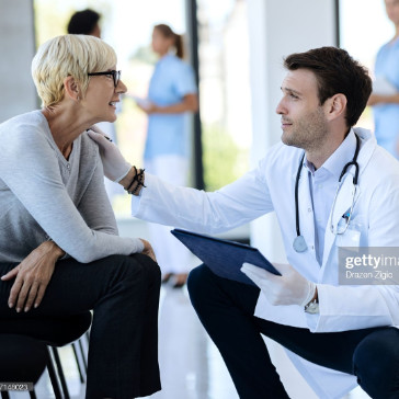 a doctor talking to a patient
